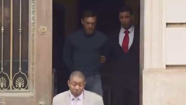 Handcuffed Conor McGregor is led out of police station Handcuffed Conor McGregor is led out of police station