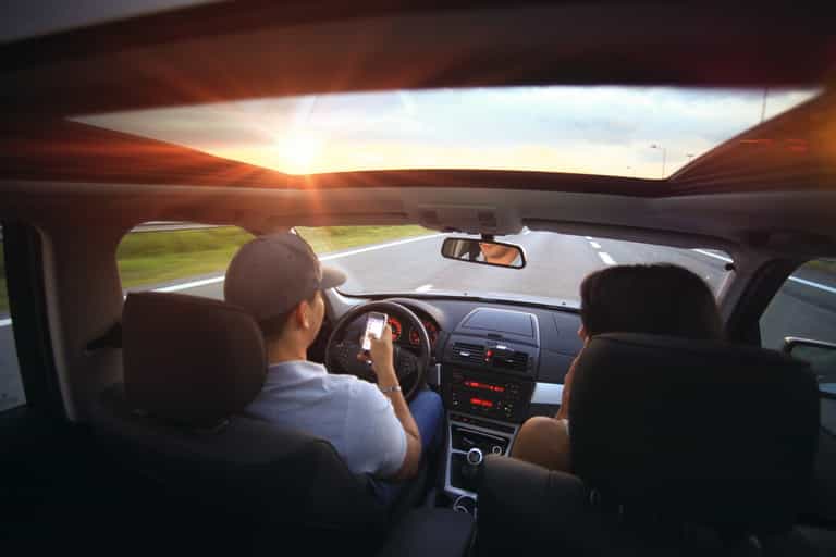 Using your phone in the passenger seat can see you fined £200 Using your phone in the passenger seat can see you fined £200