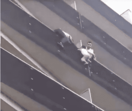 WATCH: Hero climbs up apartment building to save child hanging from balcony WATCH: Hero climbs up apartment building to save child hanging from balcony