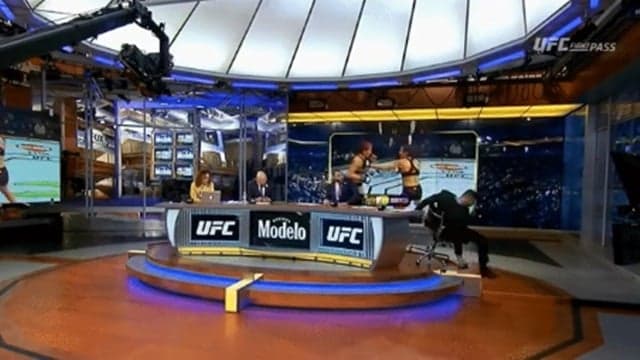 Michael Bisping avoids injury as he falls off chair while covering UFC Liverpool Michael Bisping avoids injury as he falls off chair while covering UFC Liverpool