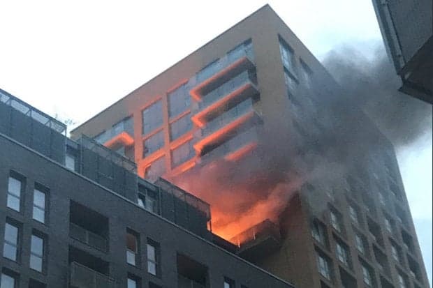Sixty firefighters battle blaze at high-rise tower block in south London Sixty firefighters battle blaze at high-rise tower block in south London