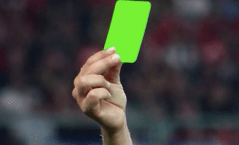 Referee brandishes first ever green card in a football match Referee brandishes first ever green card in a football match