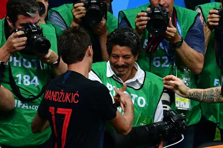 Incredible pictures taken by photographer squashed by celebrating Croatia players Incredible pictures taken by photographer squashed by celebrating Croatia players