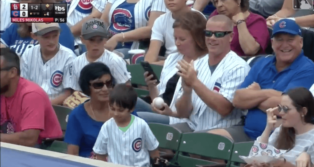 Adult man steals ball from small child at baseball game, but it’s not quite as it seems