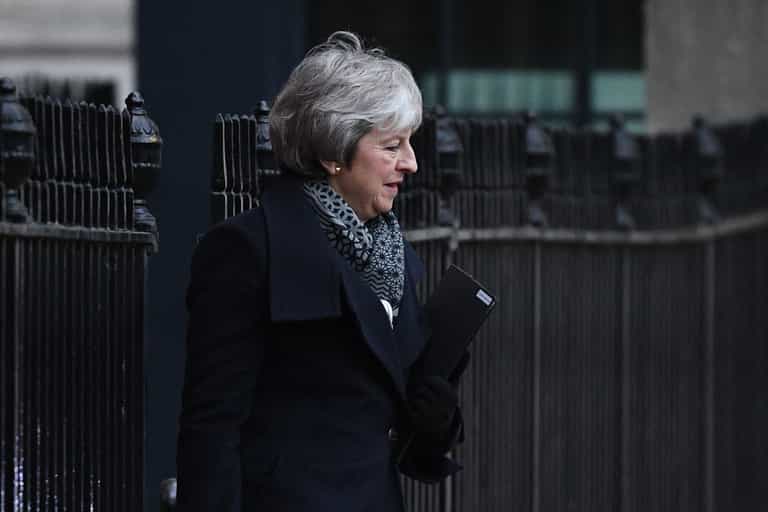 Armed police officer delivers two boxes of Krispy Kreme doughnuts to Downing Street Armed police officer delivers two boxes of Krispy Kreme doughnuts to Downing Street