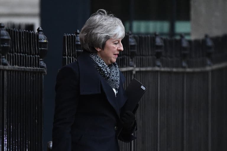 Armed police officer delivers two boxes of Krispy Kreme doughnuts to Downing Street Armed police officer delivers two boxes of Krispy Kreme doughnuts to Downing Street