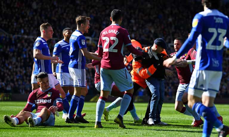 FA vows to ‘protect players’ after Grealish and Smalling targeted by pitch invaders FA vows to ‘protect players’ after Grealish and Smalling targeted by pitch invaders