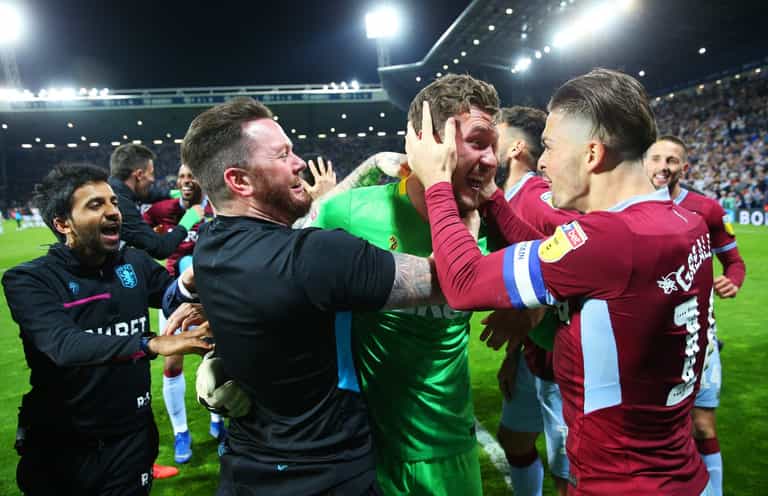 Villa goalkeeper Jed Steer stares down Mason Holgate before penalty save Villa goalkeeper Jed Steer stares down Mason Holgate before penalty save
