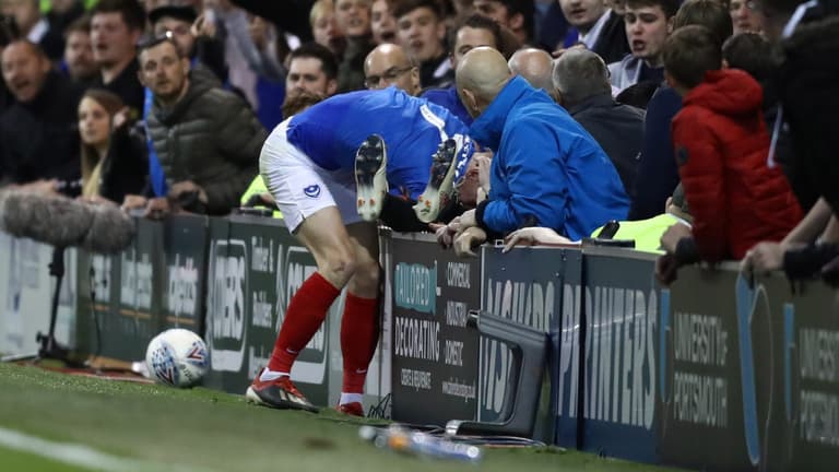 Sunderland player involved in pitchside altercation with Portsmouth supporters Sunderland player involved in pitchside altercation with Portsmouth supporters