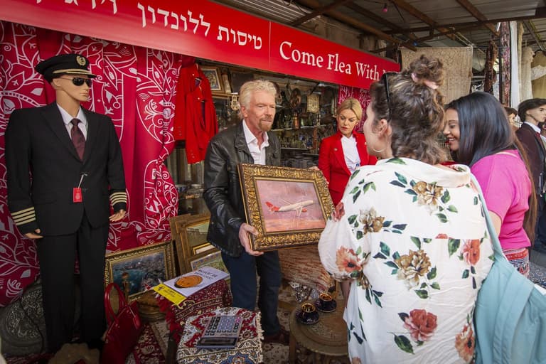 Come Flea With Me: Sir Richard Branson haggles flight prices in Tel Aviv market Come Flea With Me: Sir Richard Branson haggles flight prices in Tel Aviv market