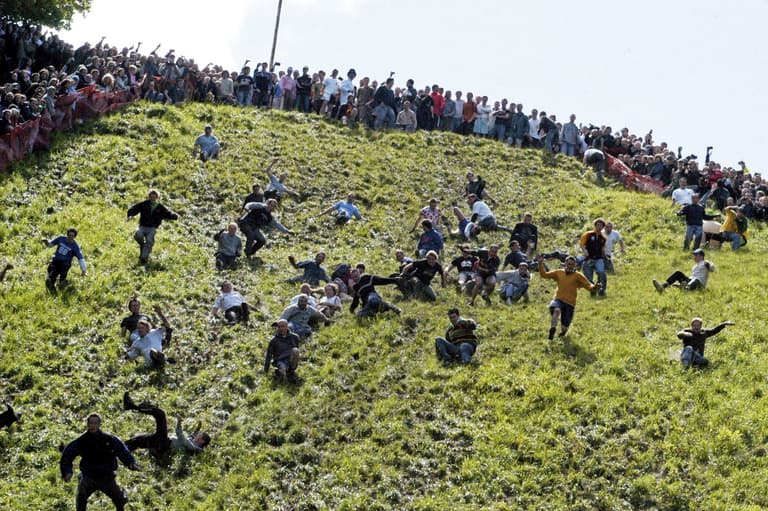 Chasing cheese down an absolutely massive hill Chasing cheese down an absolutely massive hill