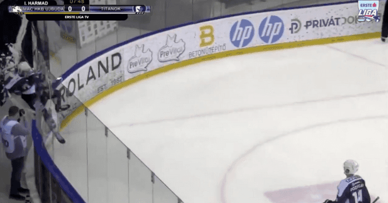 Ice hockey player celebrates so hard they smash through glass wall Ice hockey player celebrates so hard they smash through glass wall