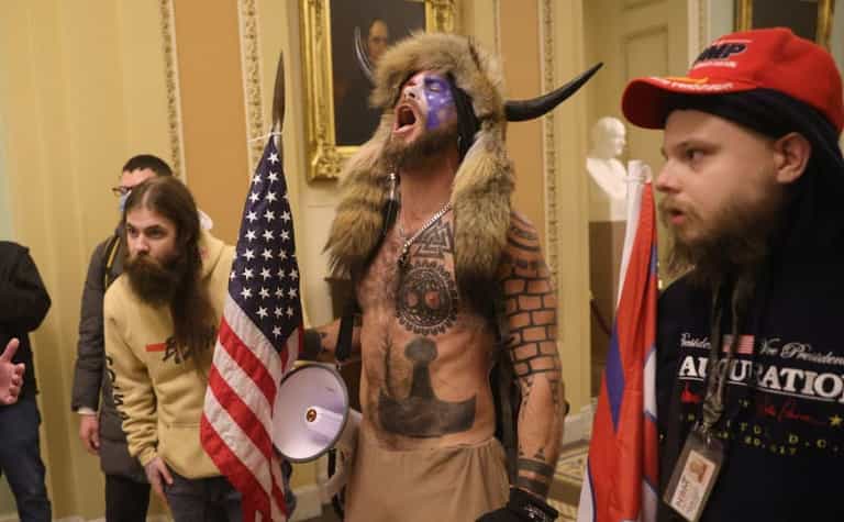 Trump supporter pictured in horns and furs charged for role in Capitol riot Trump supporter pictured in horns and furs charged for role in Capitol riot