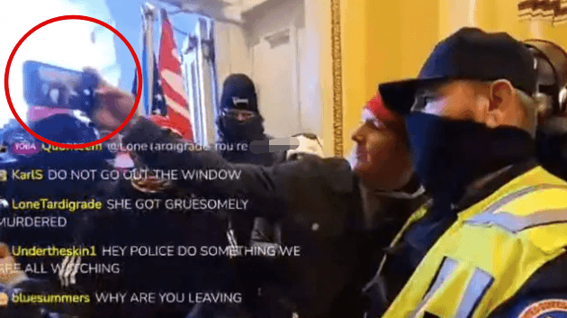 Police officer poses for selfie with pro-Trump rioter inside US Capitol Police officer poses for selfie with pro-Trump rioter inside US Capitol