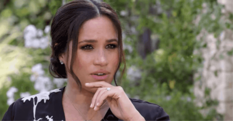 Charlie Hebdo cover sparks outrage after depicting Queen kneeling on Meghan Markle’s neck Charlie Hebdo cover sparks outrage after depicting Queen kneeling on Meghan Markle’s neck