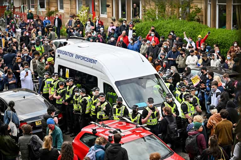 Protestors block immigration van from leaving after Glasgow Eid raid Protestors block immigration van from leaving after Glasgow Eid raid