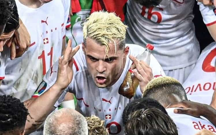 Xhaka necks a bottle of Coke before penalty shootout victory against France Xhaka necks a bottle of Coke before penalty shootout victory against France