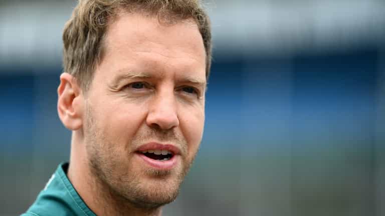 Sebastian Vettel helps tidy up Silverstone after fans leave it in a mess Sebastian Vettel helps tidy up Silverstone after fans leave it in a mess