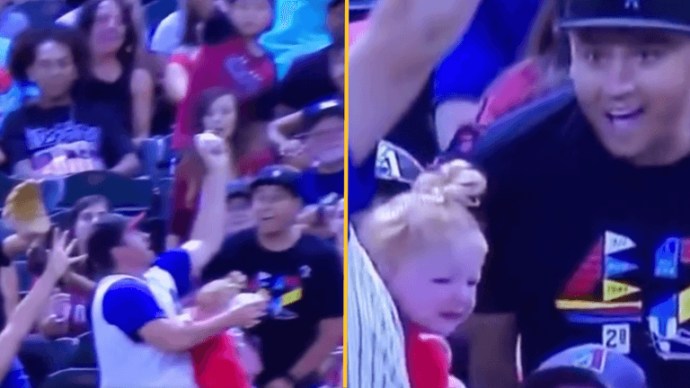 Dad drops baby, catches ball and baby without spilling his beer Dad drops baby, catches ball and baby without spilling his beer