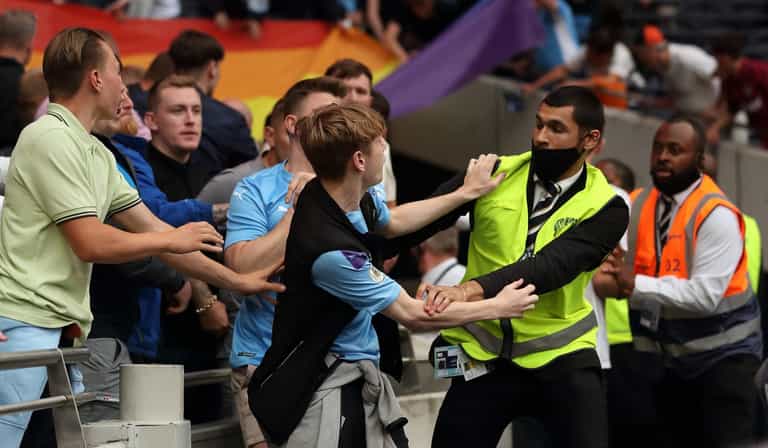 Man City fans seen tearing down rainbow banner at Spurs ground and invading pitch Man City fans seen tearing down rainbow banner at Spurs ground and invading pitch