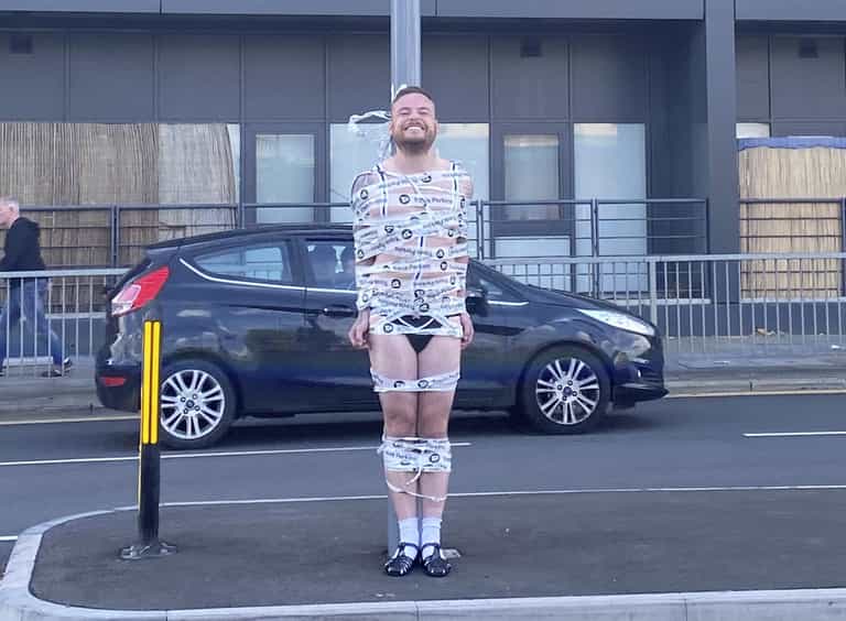 Semi-naked groom taped to traffic light in hilarious stag do prank Semi-naked groom taped to traffic light in hilarious stag do prank