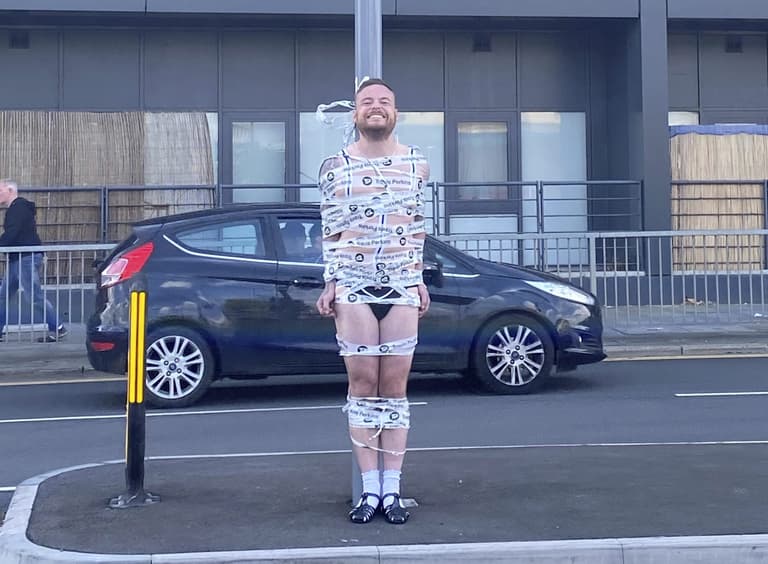 Semi-naked groom taped to traffic light in hilarious stag do prank Semi-naked groom taped to traffic light in hilarious stag do prank