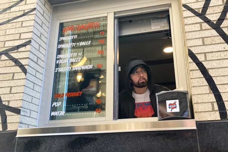 Eminem serves up to fans at his newly-opened Mom’s Spaghetti restaurant Eminem serves up to fans at his newly-opened Mom’s Spaghetti restaurant
