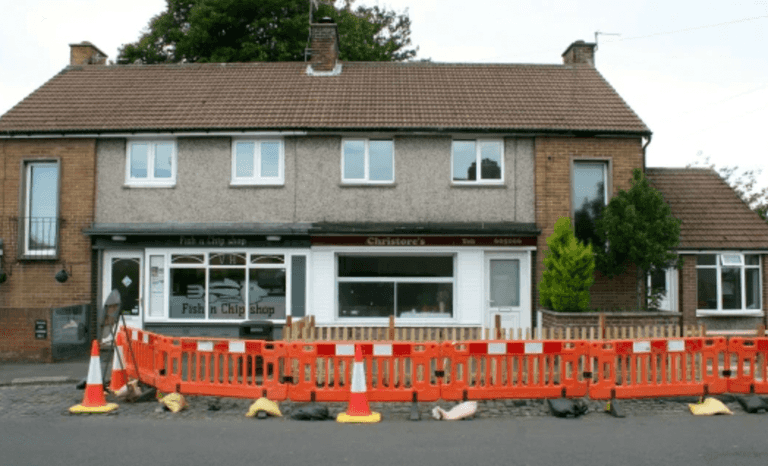 Man blocks pavement with fence to stop chippy customers staring into living room Man blocks pavement with fence to stop chippy customers staring into living room