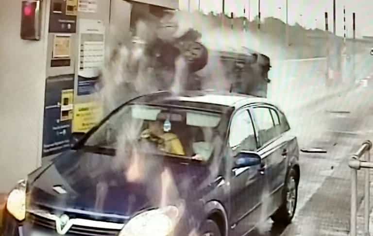 Unbelievable moment drugged up driver flips car and smashes into payment booth on M6 Unbelievable moment drugged up driver flips car and smashes into payment booth on M6