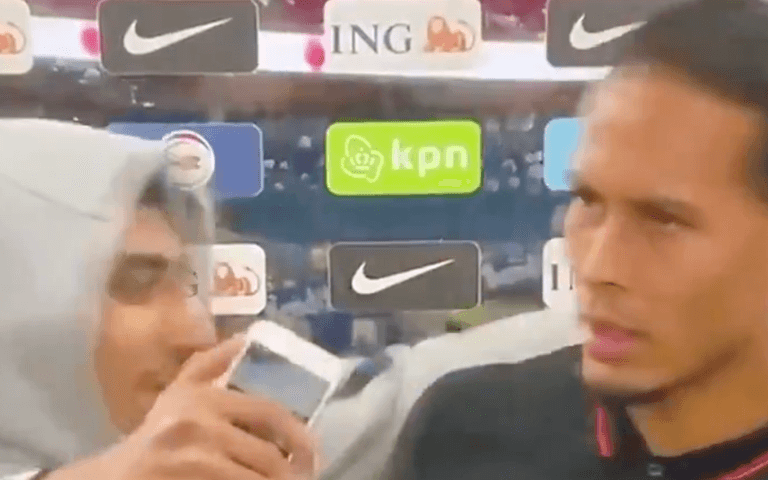 Virgil van Dijk pushes fan who storms him for a selfie during interview Virgil van Dijk pushes fan who storms him for a selfie during interview
