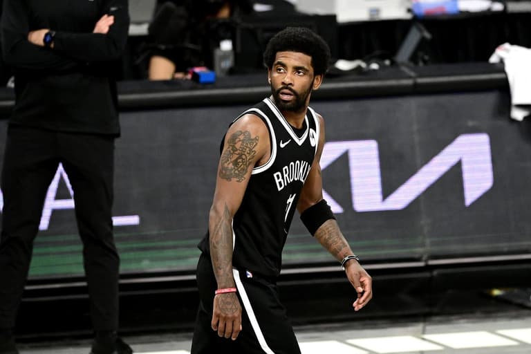 NBA star Kyrie Irving banned by team until he is fully vaccinated NBA star Kyrie Irving banned by team until he is fully vaccinated