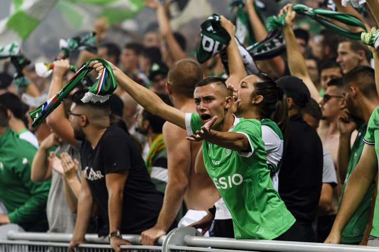 Saint-Etienne game delayed as fans throw flares on pitch in protest against Claude Puel Saint-Etienne game delayed as fans throw flares on pitch in protest against Claude Puel