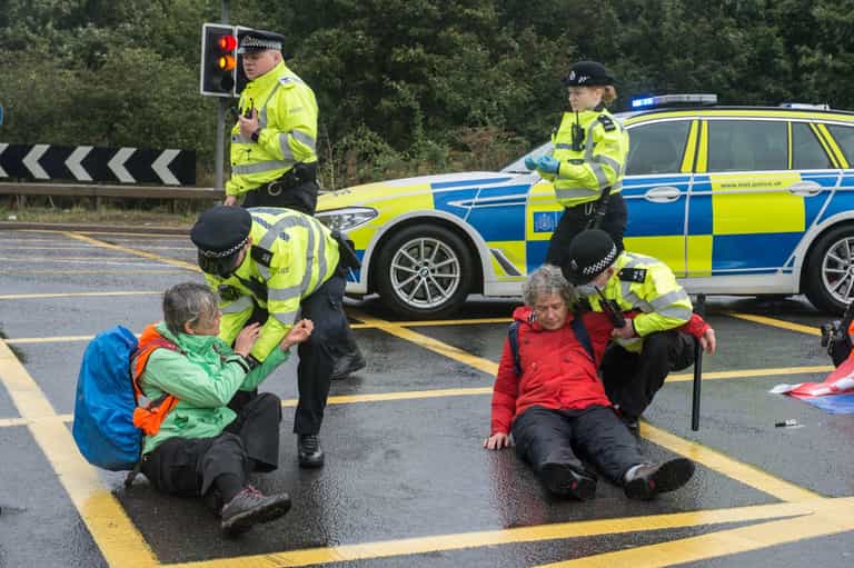Insulate Britain protestors once again dragged off road by motorists and police Insulate Britain protestors once again dragged off road by motorists and police