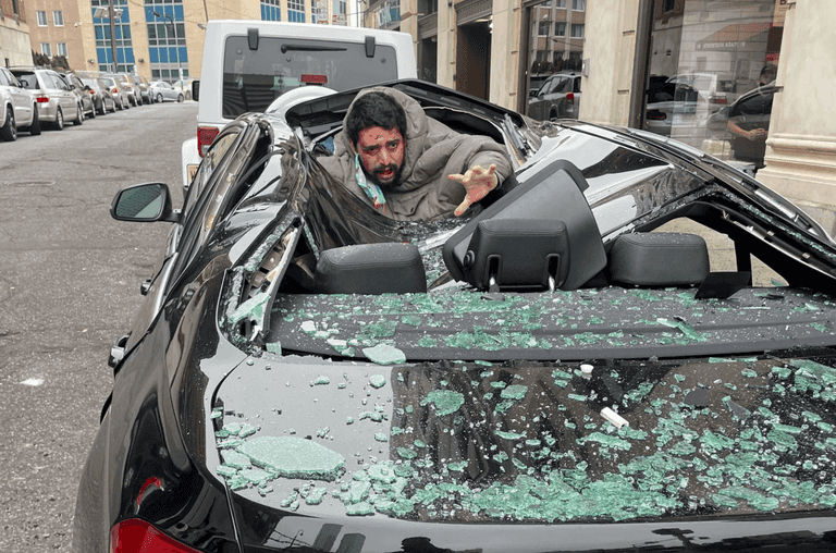 Man falls nine storeys onto car then walks away Man falls nine storeys onto car then walks away