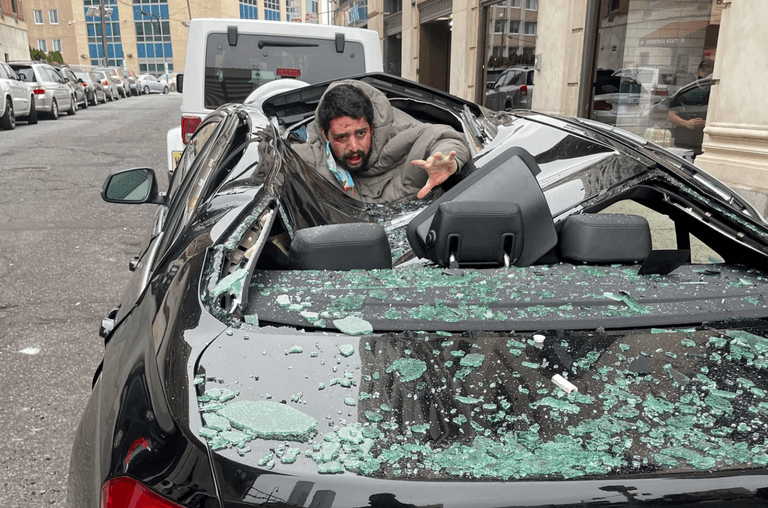 Man falls nine storeys onto car then walks away Man falls nine storeys onto car then walks away