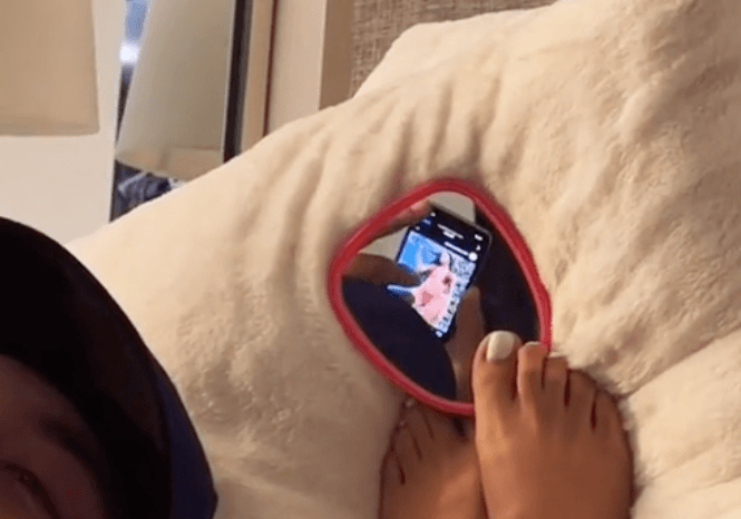 Woman sneakily uses mirror to catch her boyfriend looking at other women on Instagram Woman sneakily uses mirror to catch her boyfriend looking at other women on Instagram