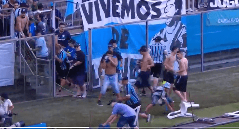 Gremio fans invade pitch and try to break VAR monitor after home defeat Gremio fans invade pitch and try to break VAR monitor after home defeat