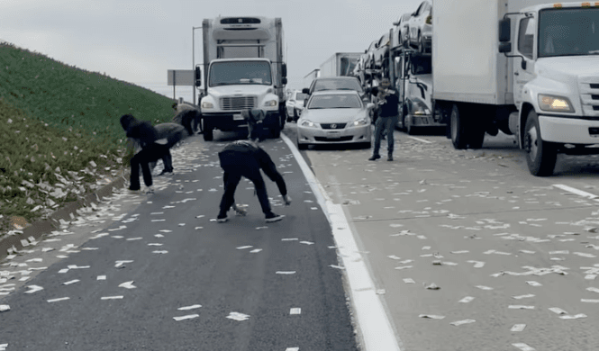 Armoured truck spills money across motorway as drivers go wild in cash grab Armoured truck spills money across motorway as drivers go wild in cash grab