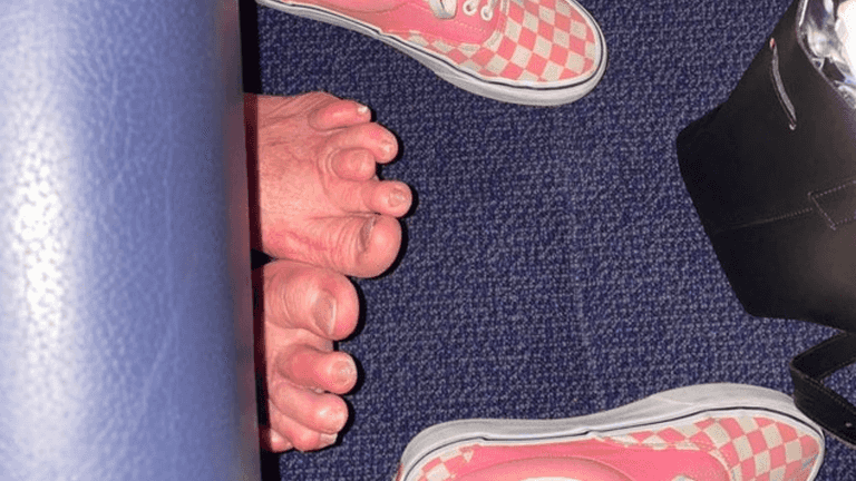 Internet disgusted at sight of bare feet sticking out under plane seat Internet disgusted at sight of bare feet sticking out under plane seat