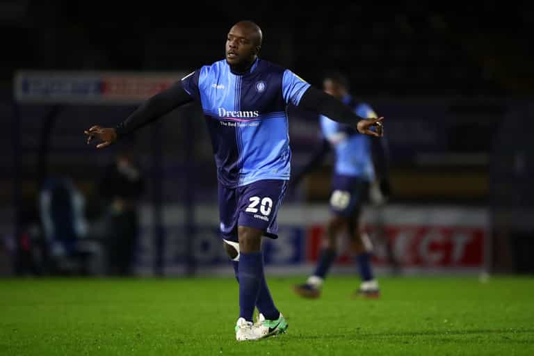Adebayo Akinfenwa furiously confronts MK Dons fans following vile chant Adebayo Akinfenwa furiously confronts MK Dons fans following vile chant