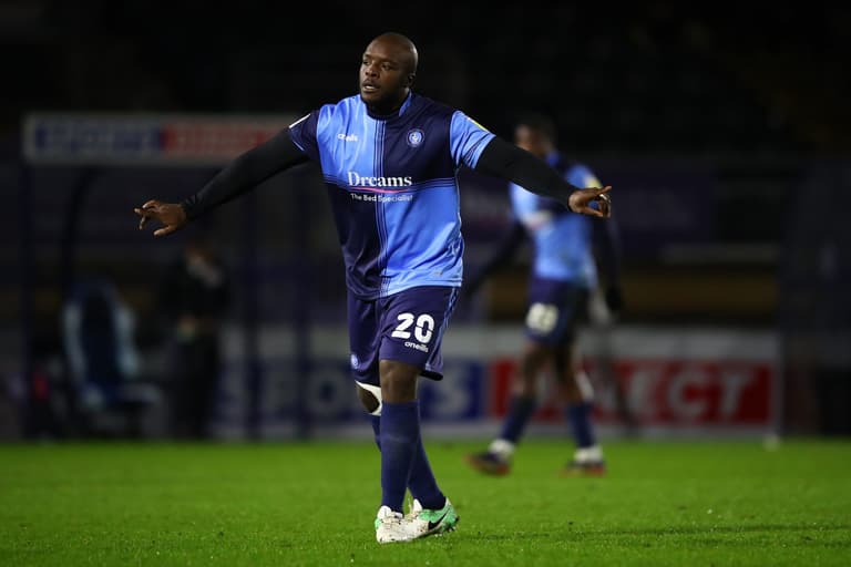 Adebayo Akinfenwa furiously confronts MK Dons fans following vile chant Adebayo Akinfenwa furiously confronts MK Dons fans following vile chant