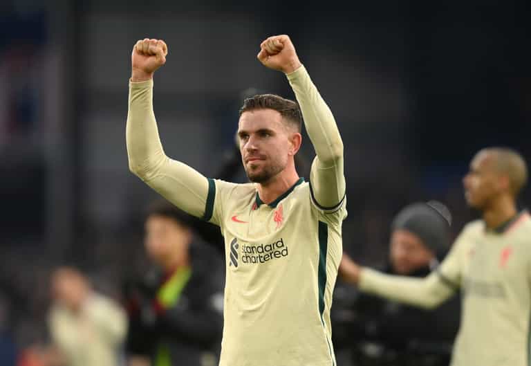Hero Jordan Henderson tries to prevent Liverpool fan from taking shirt off child Hero Jordan Henderson tries to prevent Liverpool fan from taking shirt off child