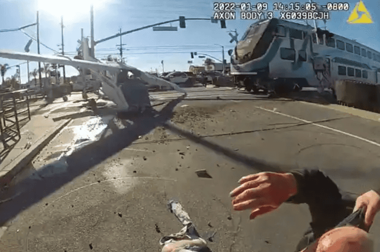 Police pull pilot out of plane crash seconds before train hits Police pull pilot out of plane crash seconds before train hits