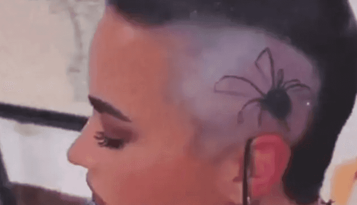 Demi Lovato tattoos giant spider on their head Demi Lovato tattoos giant spider on their head