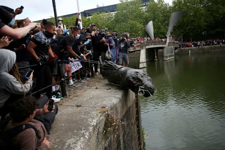 Black Lives Matter protesters cleared over toppling monument of slave trader Edward Colston Black Lives Matter protesters cleared over toppling monument of slave trader Edward Colston
