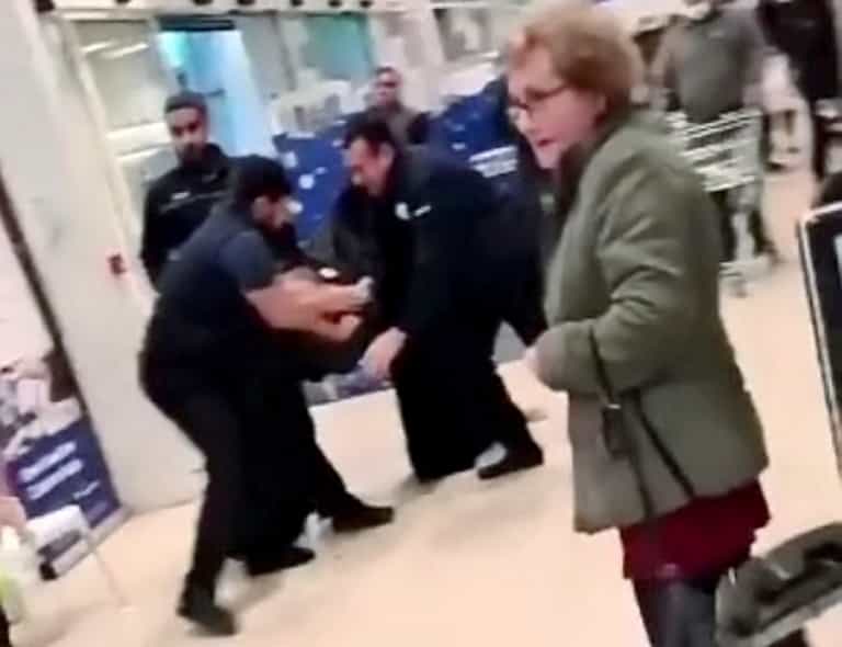Shocking footage shows mass brawl at Tesco as fearless pensioner casually continues her shopping Shocking footage shows mass brawl at Tesco as fearless pensioner casually continues her shopping