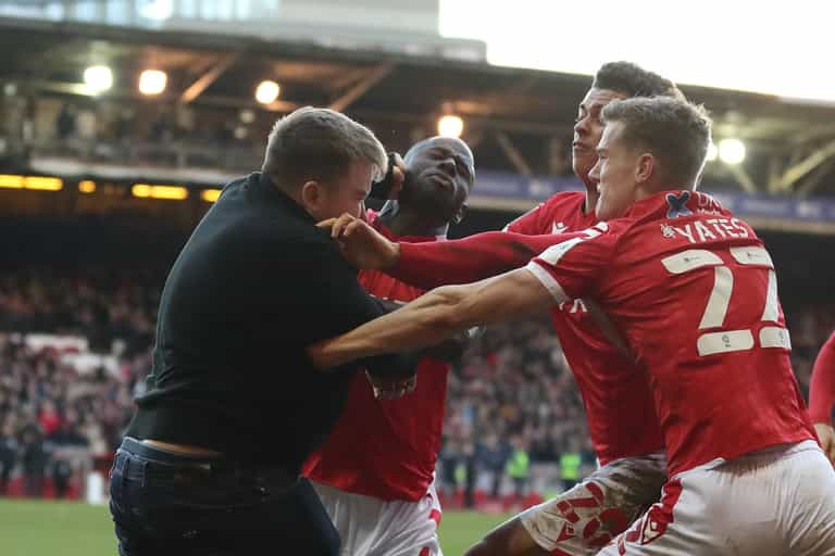 Pitch invader punches Nottingham Forest player during goal celebrations Pitch invader punches Nottingham Forest player during goal celebrations