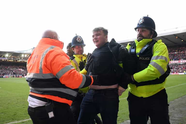 Leicester fan banned for life and arrested after attacking Nottingham Forest players Leicester fan banned for life and arrested after attacking Nottingham Forest players