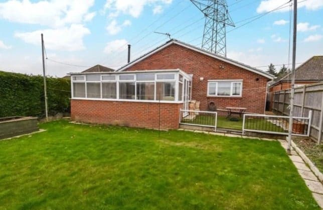 Listing for £350,000 bungalow conveniently ignores the giant pylon in front garden Listing for £350,000 bungalow conveniently ignores the giant pylon in front garden