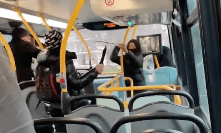 Passengers look on as schoolboys launch knife fight on top of bus in shocking footage Passengers look on as schoolboys launch knife fight on top of bus in shocking footage